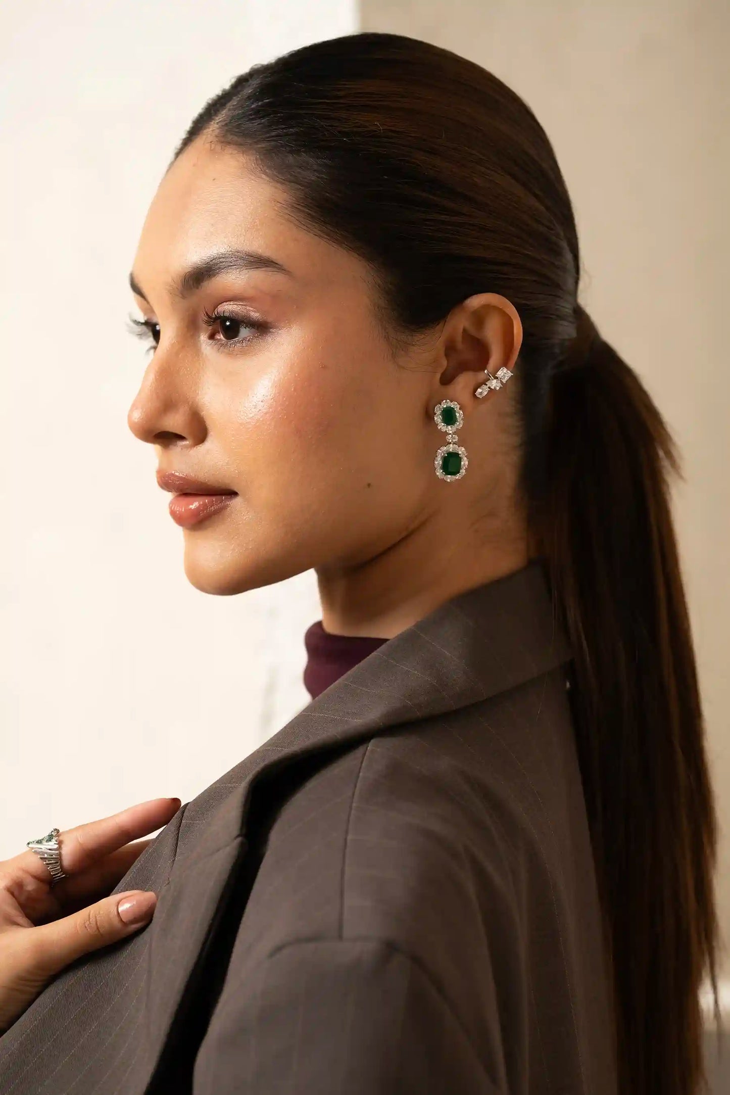 Tiramisu Jewellery handcrafted chandelier earrings with vivid emerald stones and sparkling diamond frames in a refined silhouette