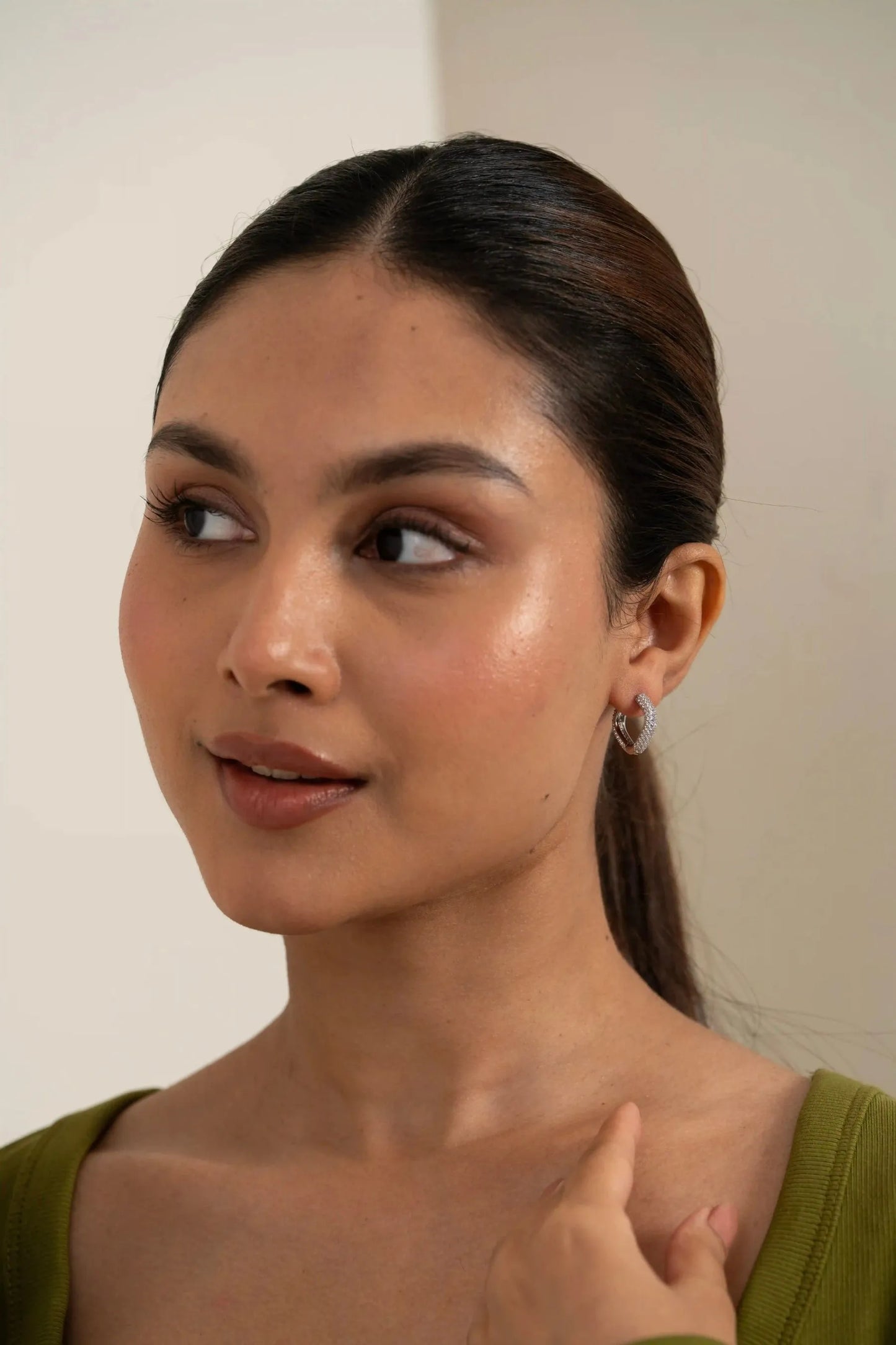 High-resolution close-up of a pavé diamond hoop earring, elegant and timeless jewelry style