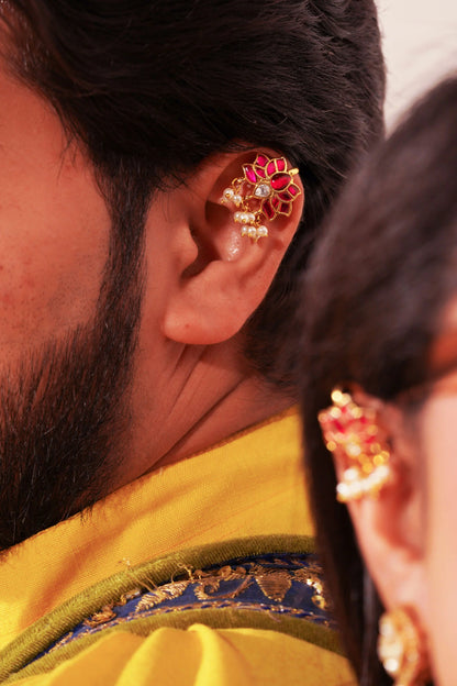Premium gold hoop drop earrings with red and white stone detailing in minimal styling
