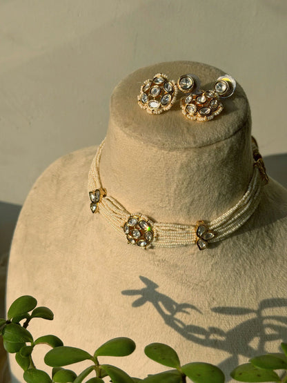 Premium Indian wedding choker with kundan work and teardrop pendant on mannequin bust
