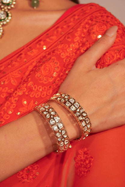 Sophisticated wrist shot featuring a statement bracelet with petal-like stone groupings in a refined design.
