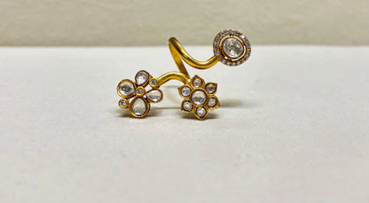 Elegant gold adjustable ring with flower motifs and clear gemstones in detailed close-up accents

