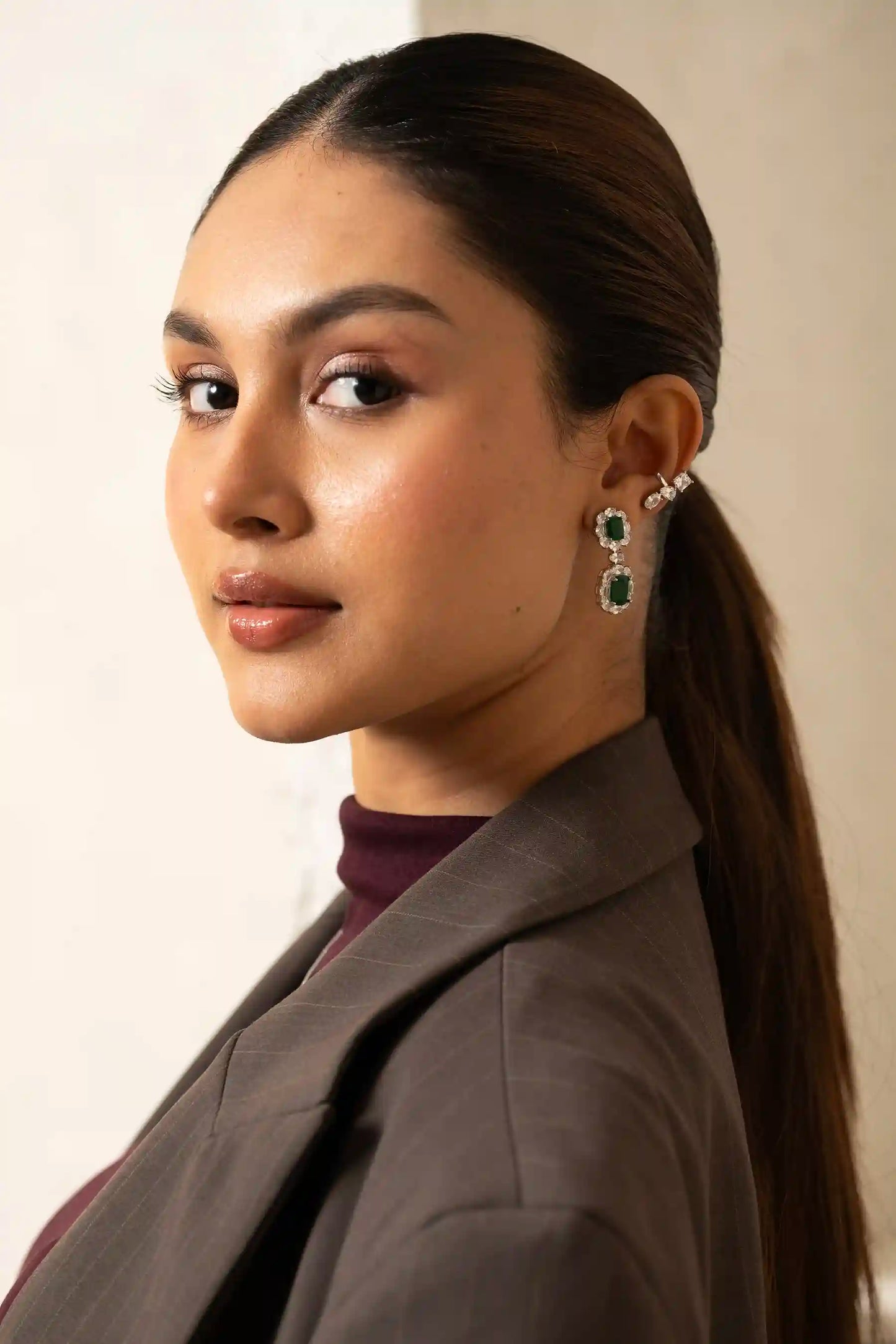 Luxurious Tiramisu Jewellery emerald drop earrings designed with cascading diamonds and bold green stones that command attention
