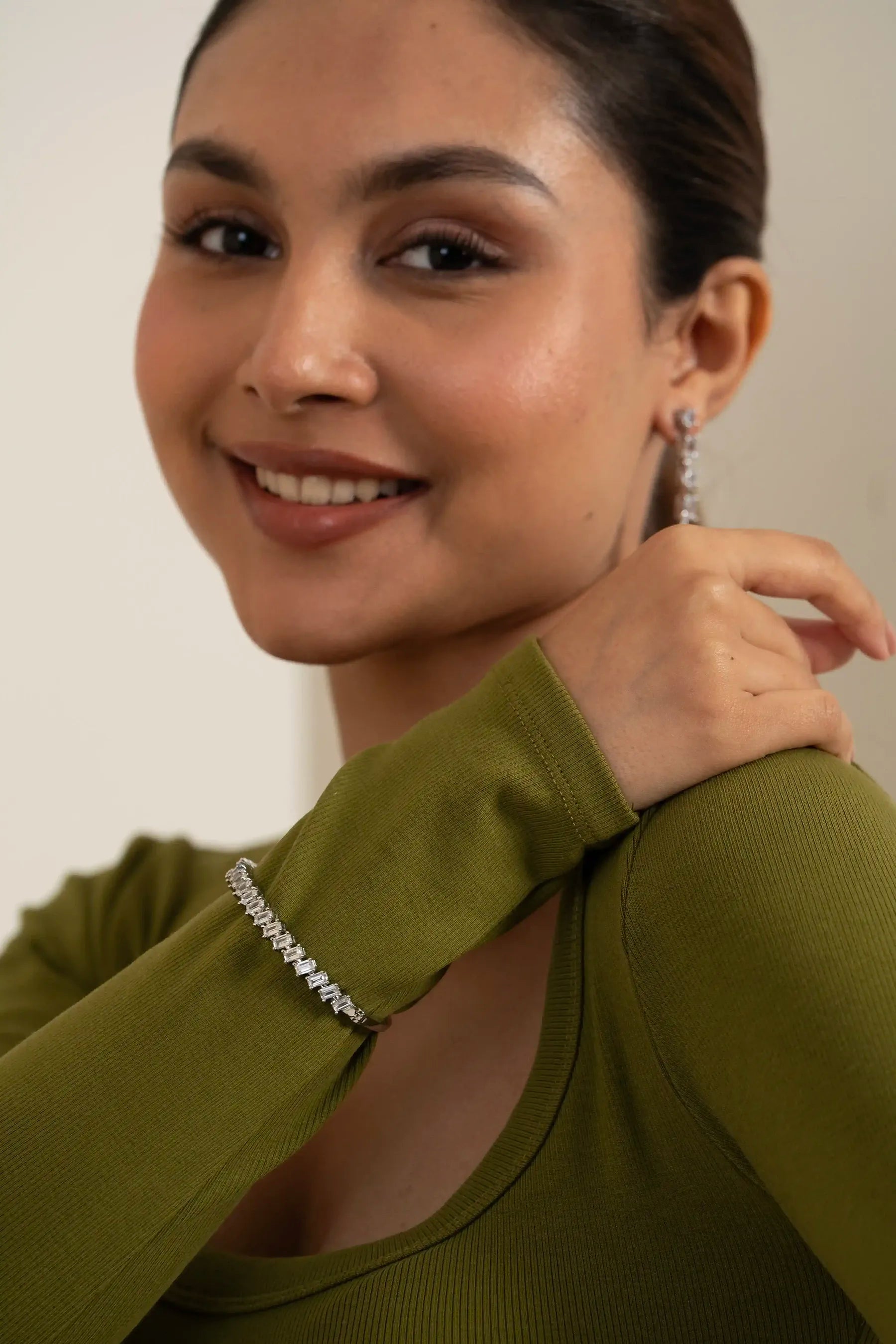 Close-up of a sparkling tennis bracelet on a wrist, highlighting premium jewelry craftsmanship