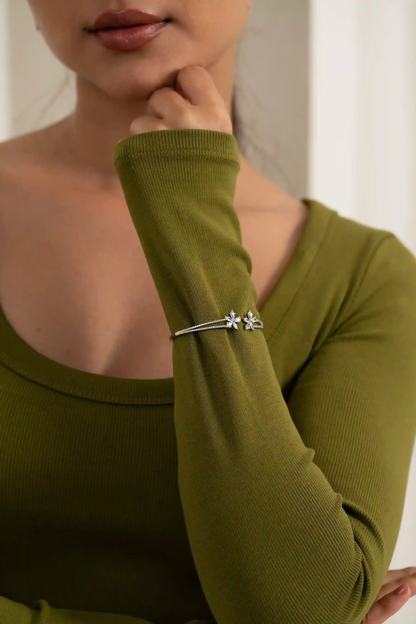 High-end floral diamond bracelet worn on wrist, luxury jewelry for women close-up