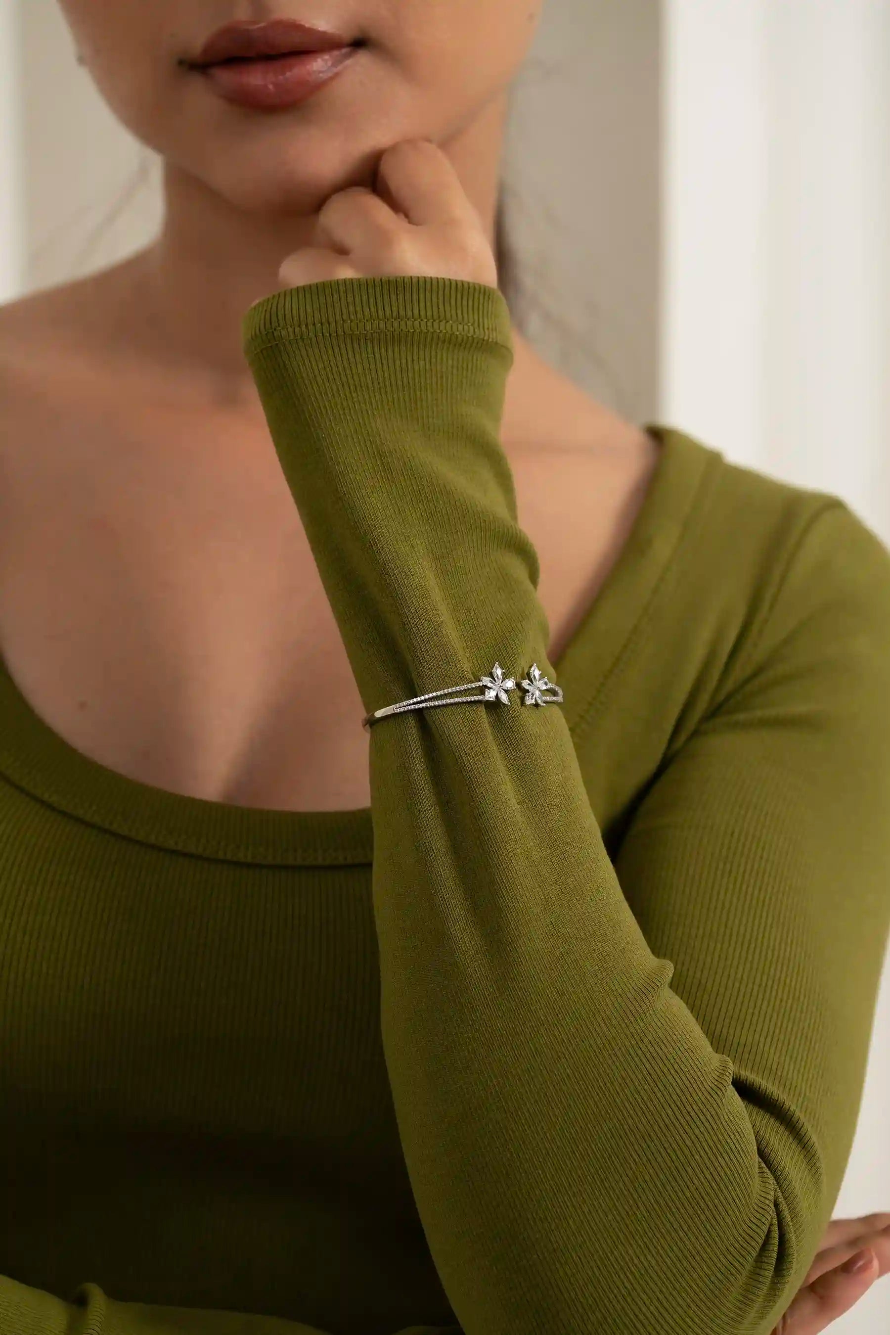 High-end floral diamond bracelet worn on wrist, luxury jewelry for women close-up