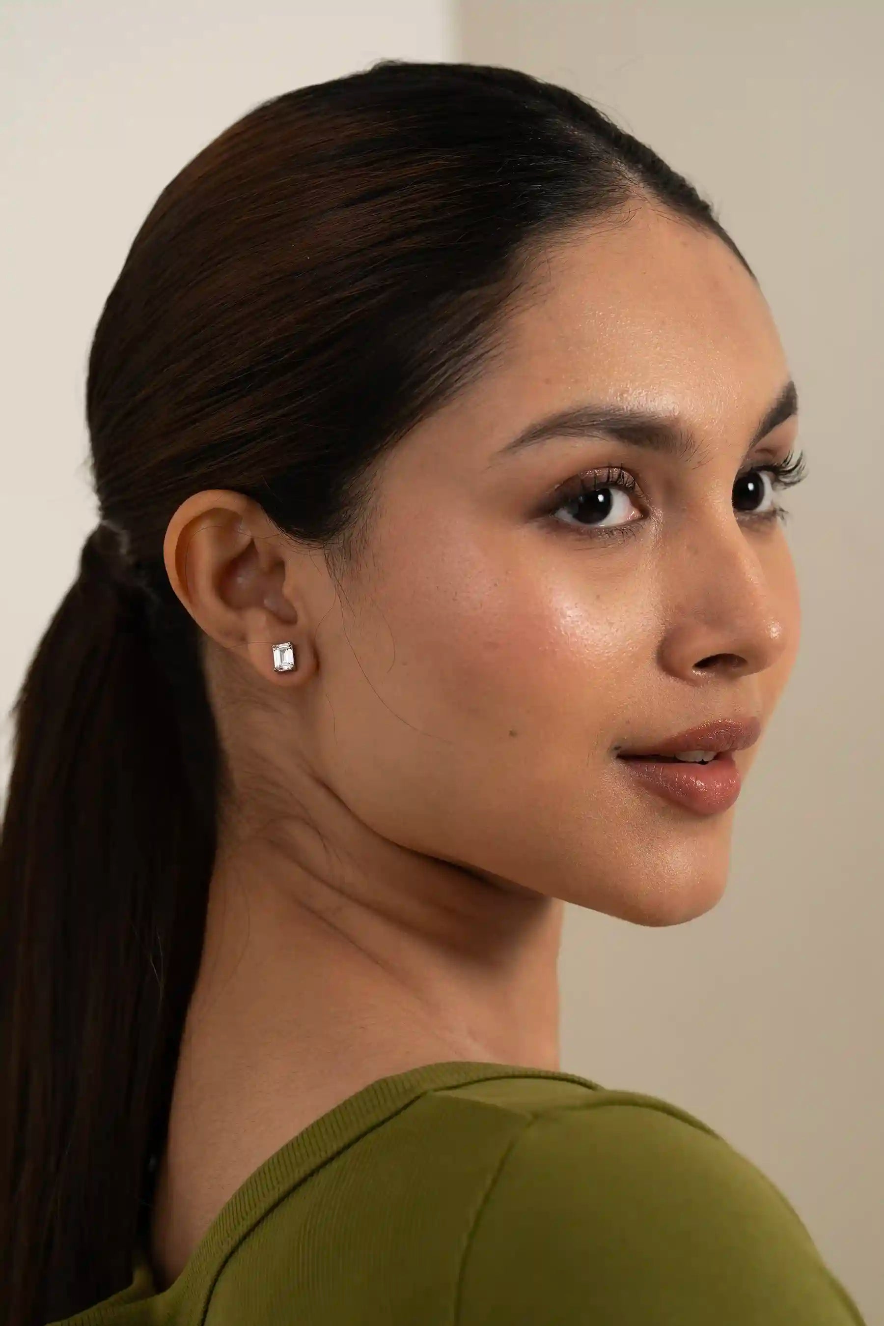 Rectangular emerald cut diamond stud earring, showcasing minimal and modern fine jewelry