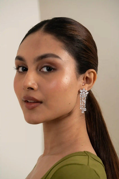 Floral diamond earring with cascading drop chains, showcasing luxury and elegant jewelry craftsmanship