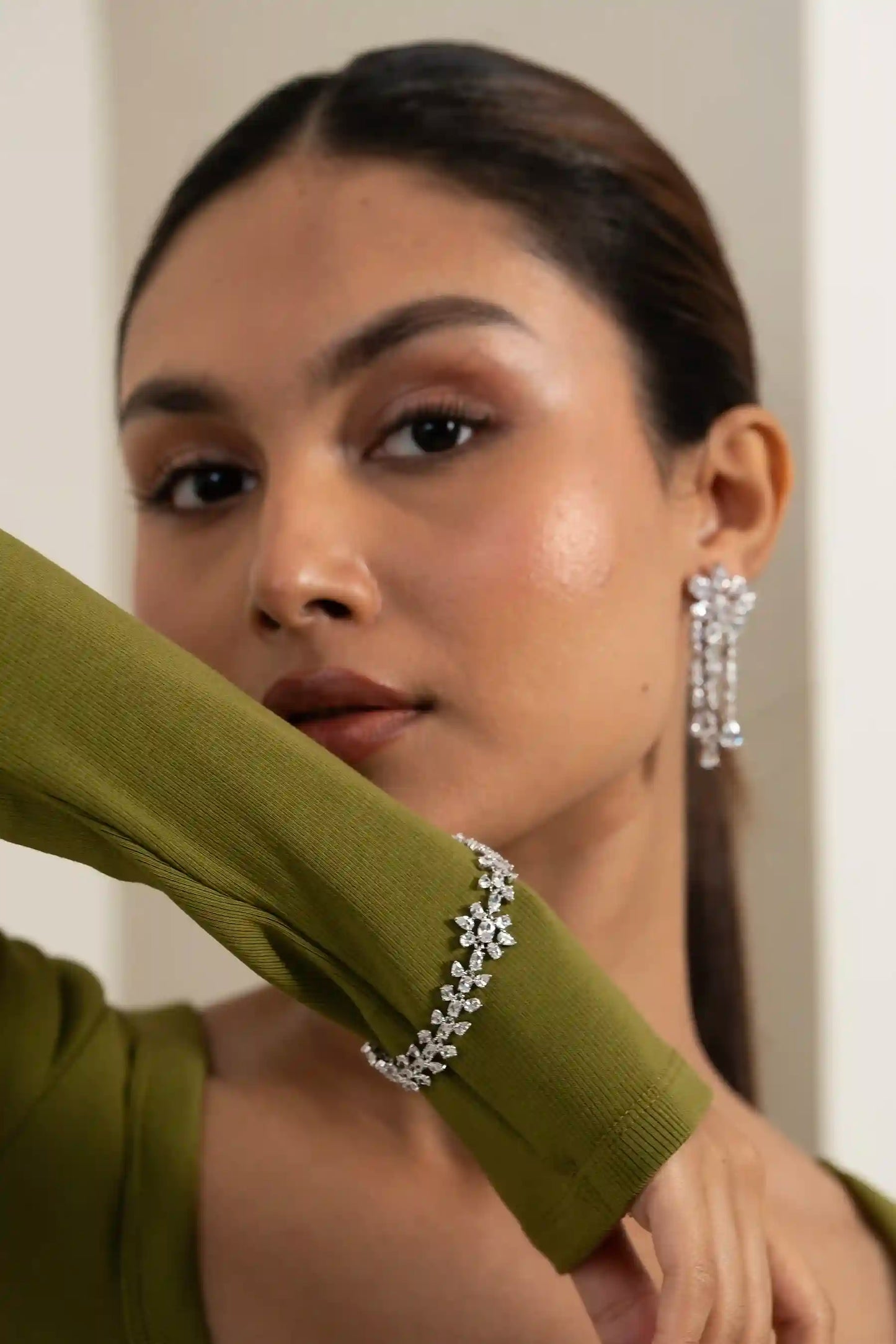 Diamond bracelet with continuous daisy motif, sparkling cluster design on wrist, minimal editorial look