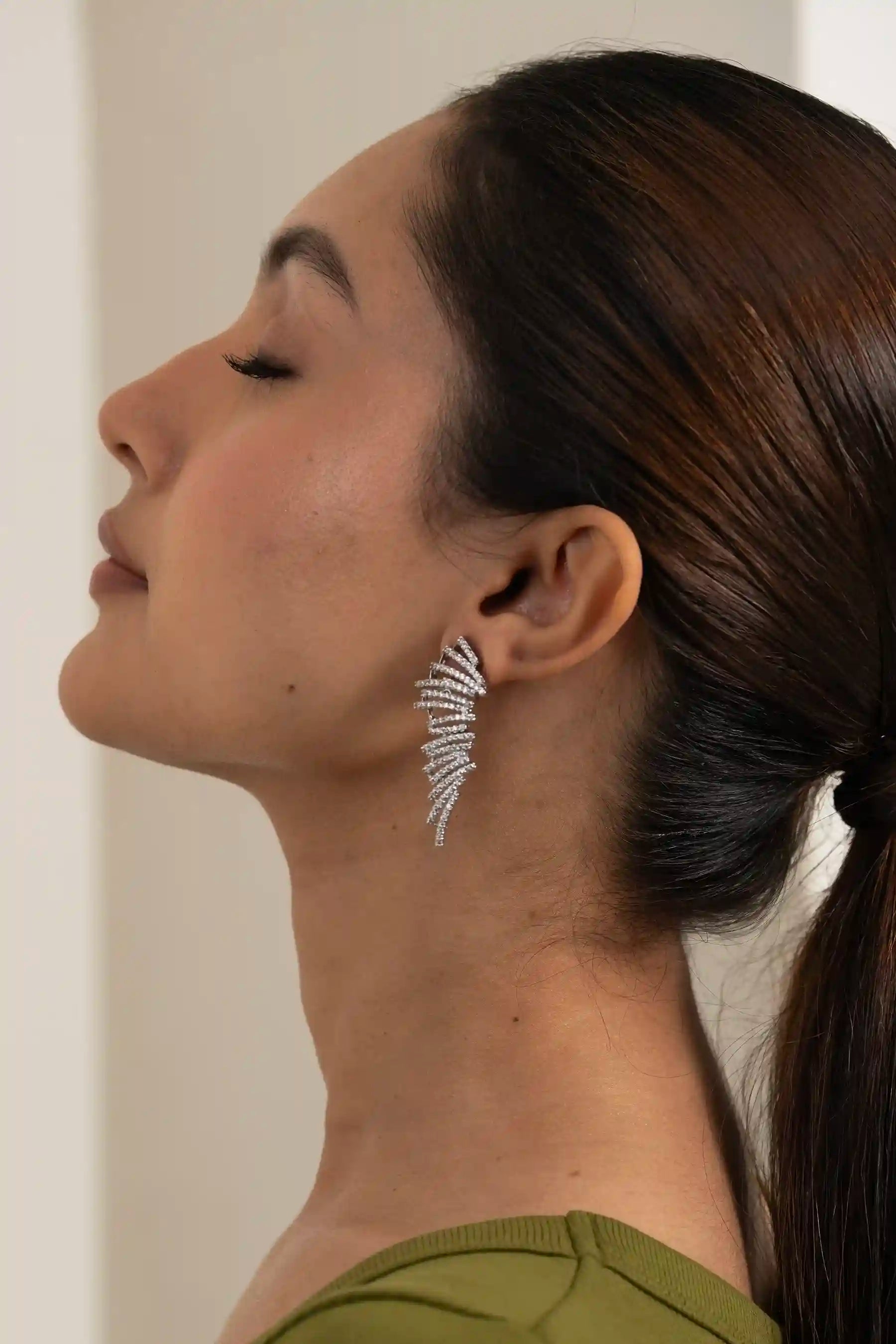 Luxury feather-inspired ear climber earring with fine diamond detailing, modern handcrafted demi-fine jewellery