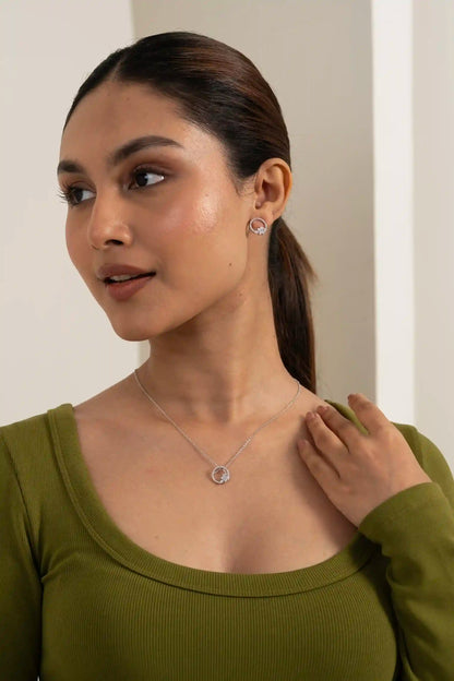 Close-up of open circle diamond stud earring with cluster design and fine detailing